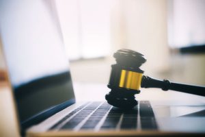 Auction Or Law Gavel On A Computer Keyboard.