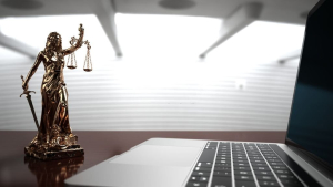 Lady Justice Statue With A Notebook In The Office. 3d Illustration.